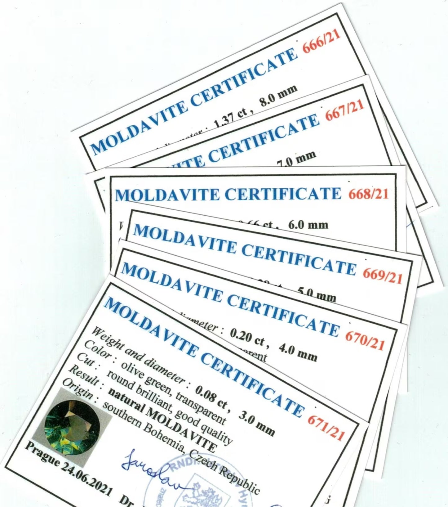 Multiple Moldavite certificates with varying details on a white background